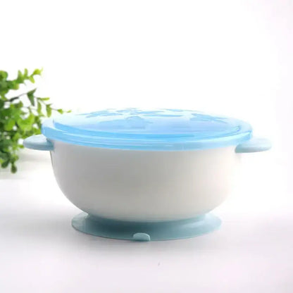 Suction bowl for babies with strong suction base and blue lid, ideal for mess-free weaning and self-feeding.