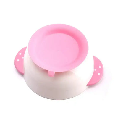 Suction bowl for babies with a pink top and secure suction base for mess-free mealtime. Ideal for toddlers learning to self-feed.