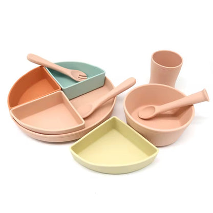 Close-up of silicone bowl and plate showing removable compartment, perfect for babies.