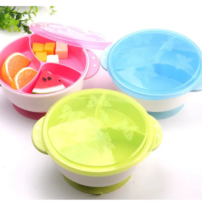 Colorful suction bowls for babies with compartments for snacks, designed for mess-free feeding and easy cleaning.